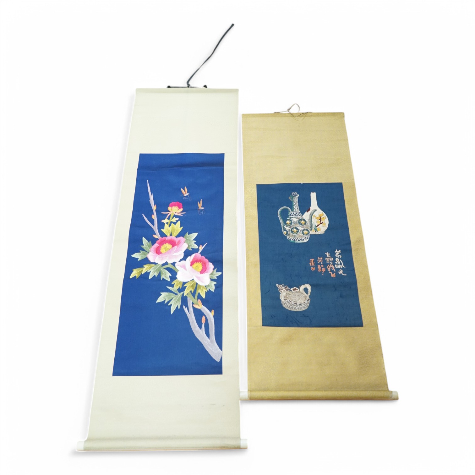 Two early 20th century Chinese embroidered silk scrolls to include one depicting flowers. Condition - fair/good